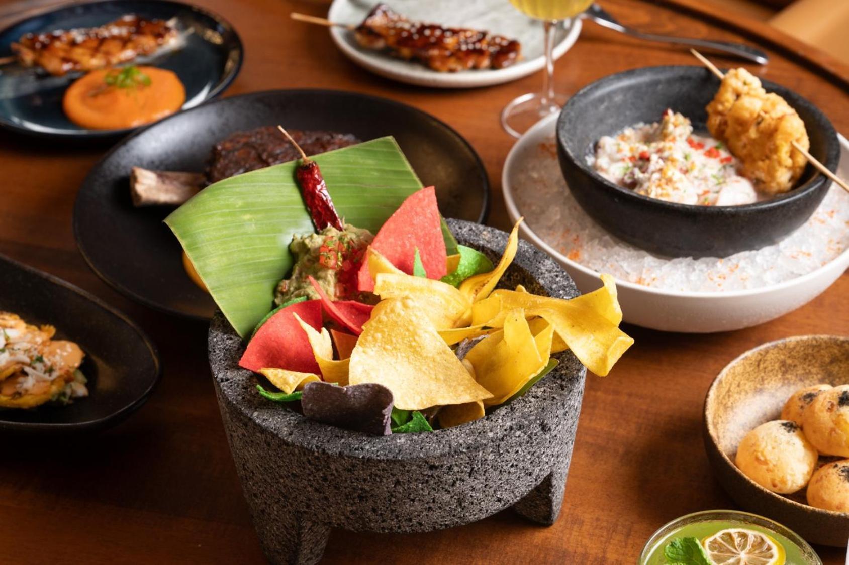 V Hotel Dubai, Curio Collection By Hilton Εξωτερικό φωτογραφία A selection of dishes at the restaurant